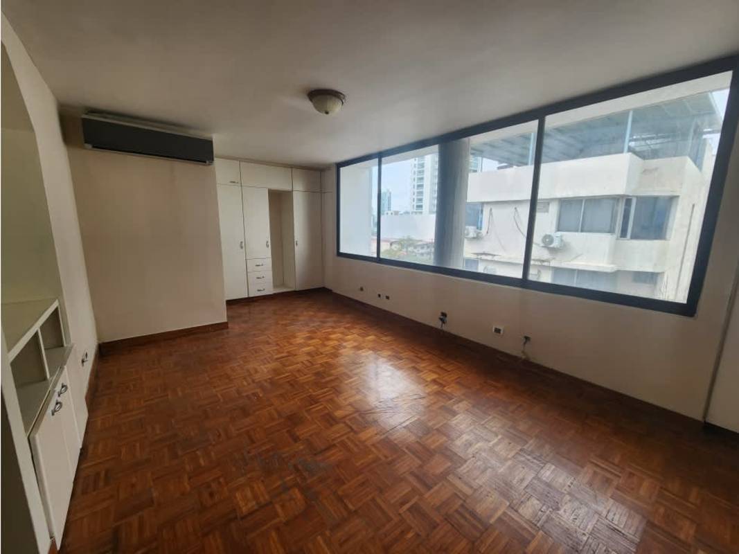 Bedroom with built-in closets, window view and wood parquet floors in PH Waterfront Coco del Mar Panama City