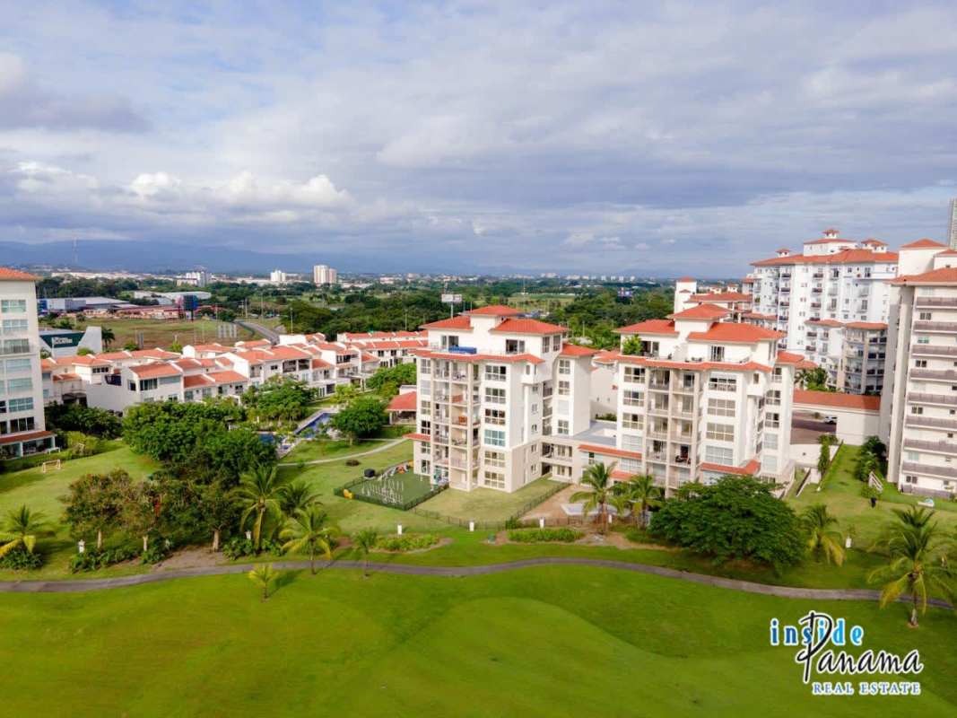 Modern master bedroom with large windows and panoramic golf views in The Reserve Santa Maria Panama