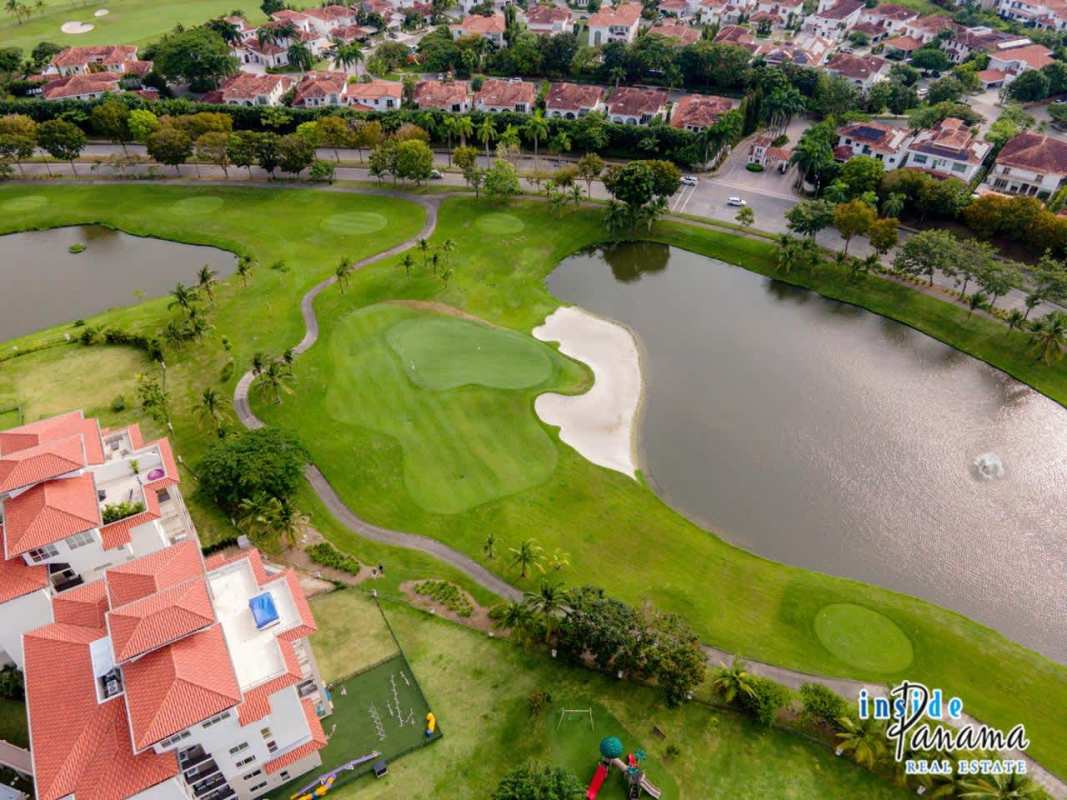 Modern spacious living room with panoramic terrace access at The Reserve Santa Maria Panama City