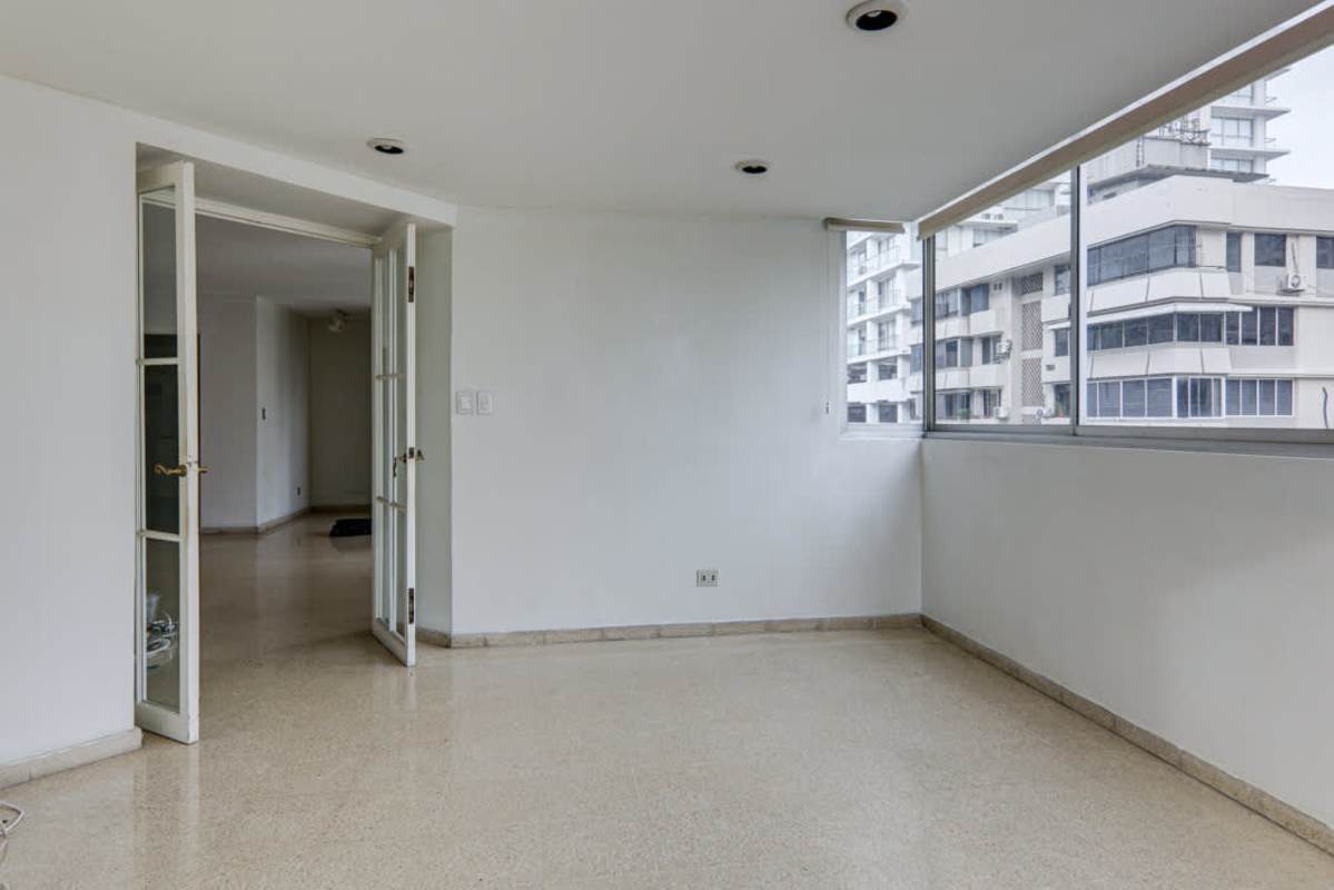 Vintage-style bathroom with decorative tiles, single vanity and mirrors in PH Marina Plaza Panama