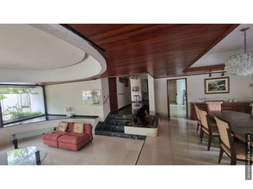 Spacious shaded terrace with pool and garden at large home in Obarrio Panama City