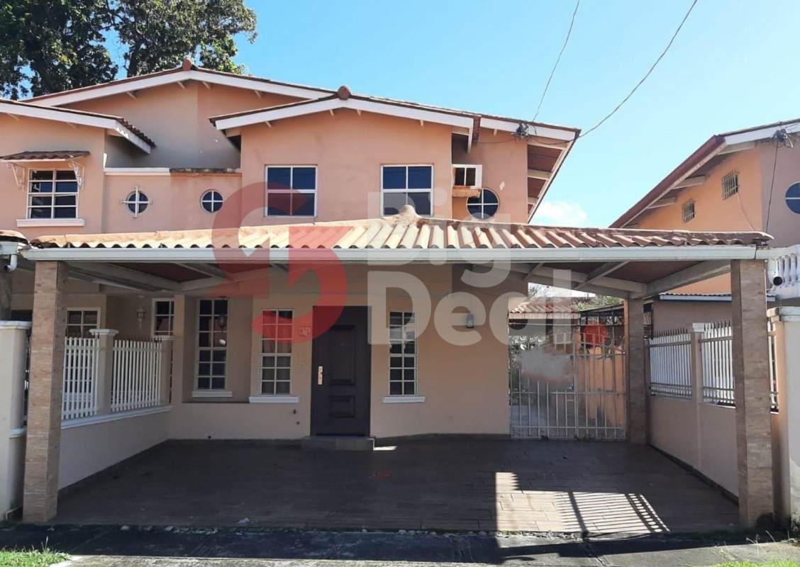 Two-story peach house with fence and carport Condado del Rey Panama City