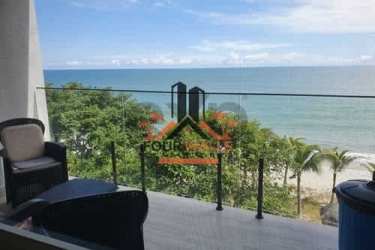 Private balcony with glass railing overlooking Pacific Ocean in Playa Caracol Sanctuary Tower