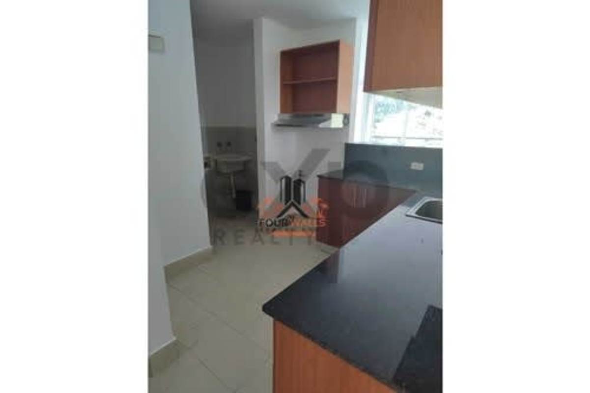 Kitchen with granite counters wooden cabinets window and utility area PH Met View Betania Panama