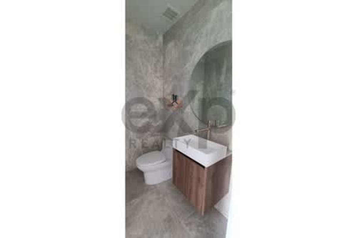 Modern kitchen with large marble island, window lighting in PH The Towers Punta Paitilla