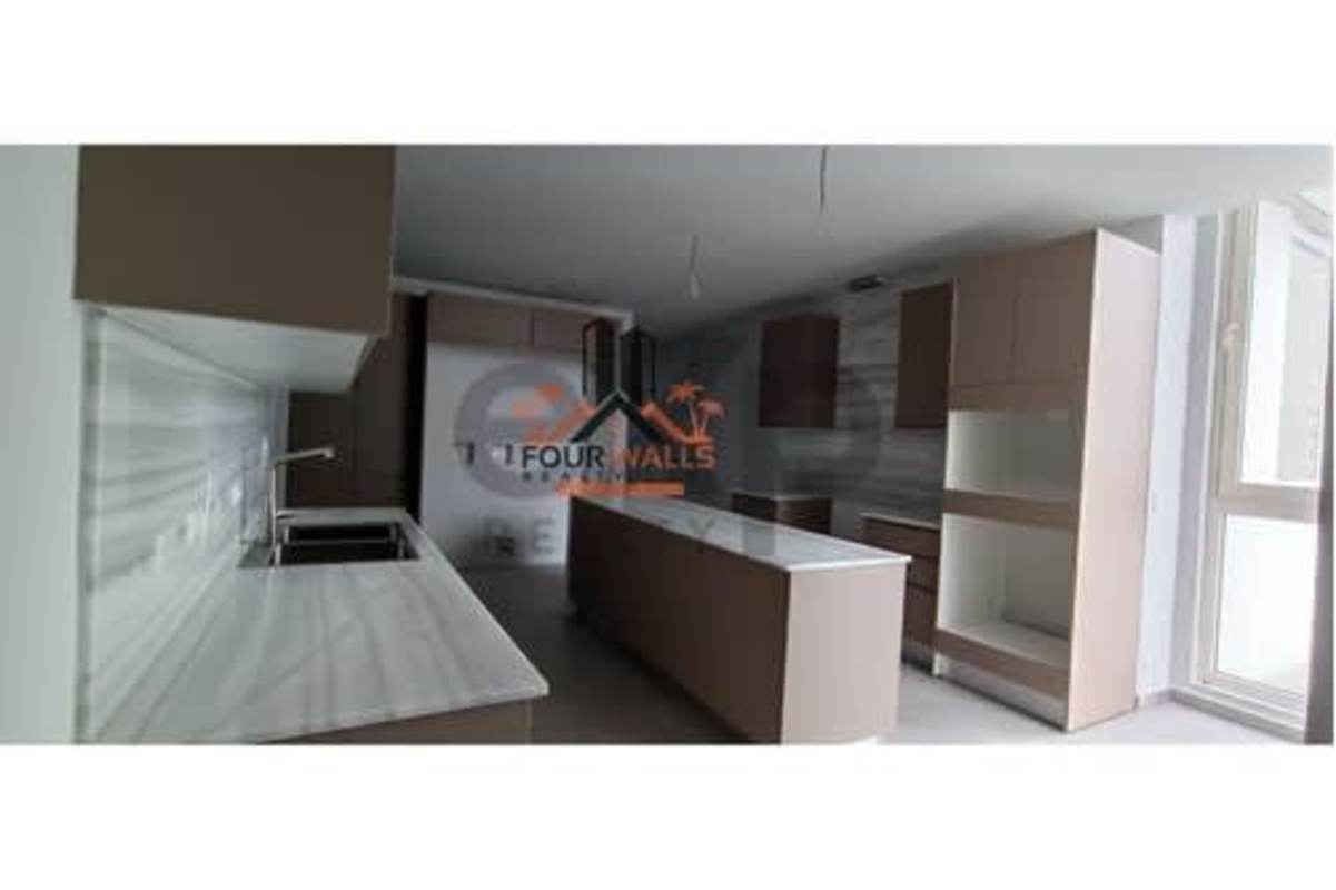 Elegant bathroom with floating vanity, marble walls and walk-in shower at PH The Towers Panama