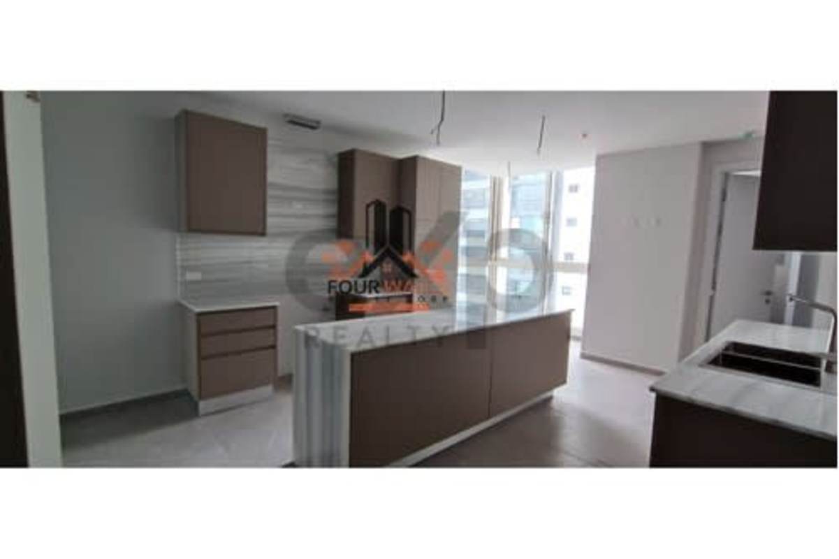 Minimalist open living space with marble floors at PH The Towers Punta Paitilla