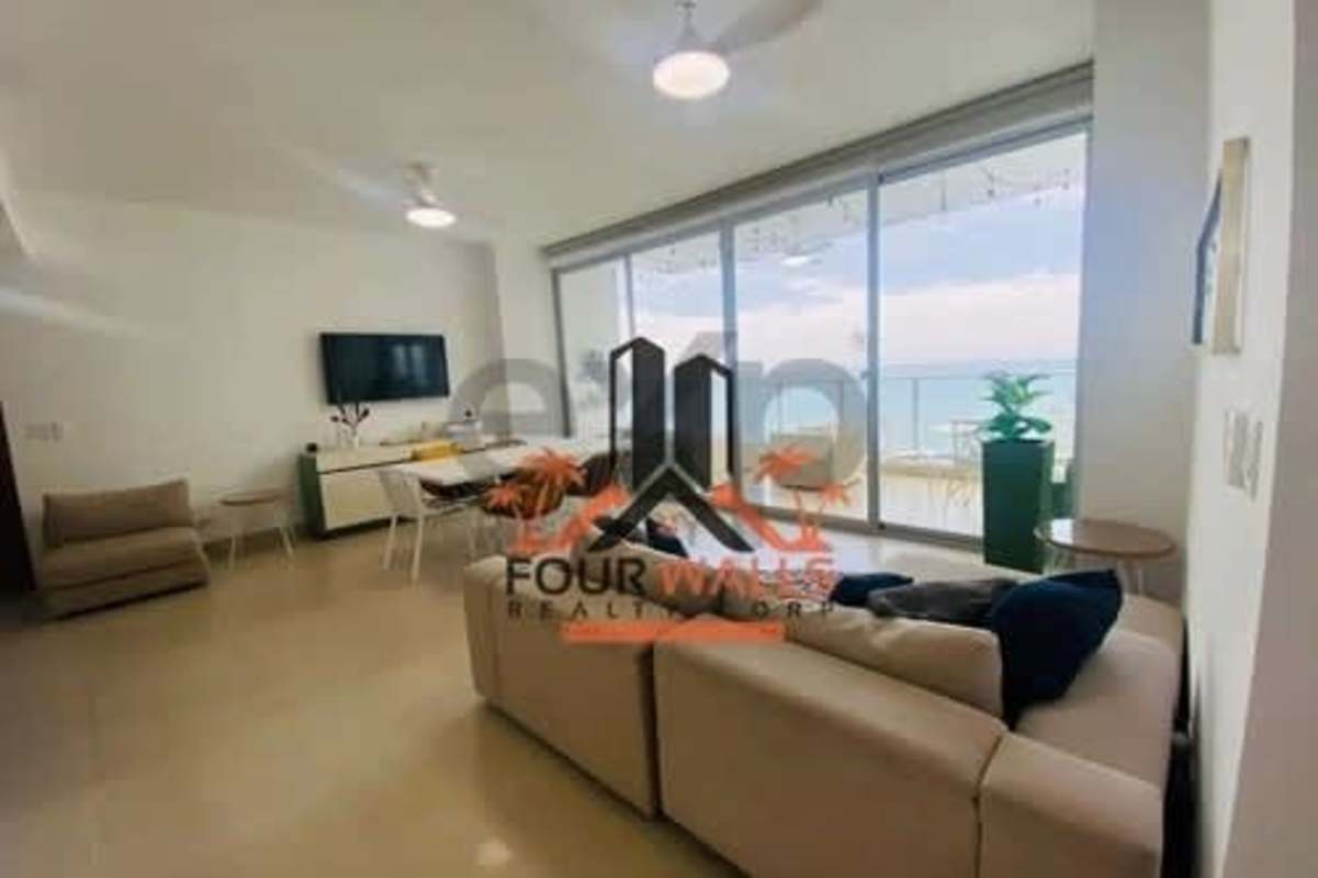 Open-plan modern living room with neutral tones Punta Pacifica Panama