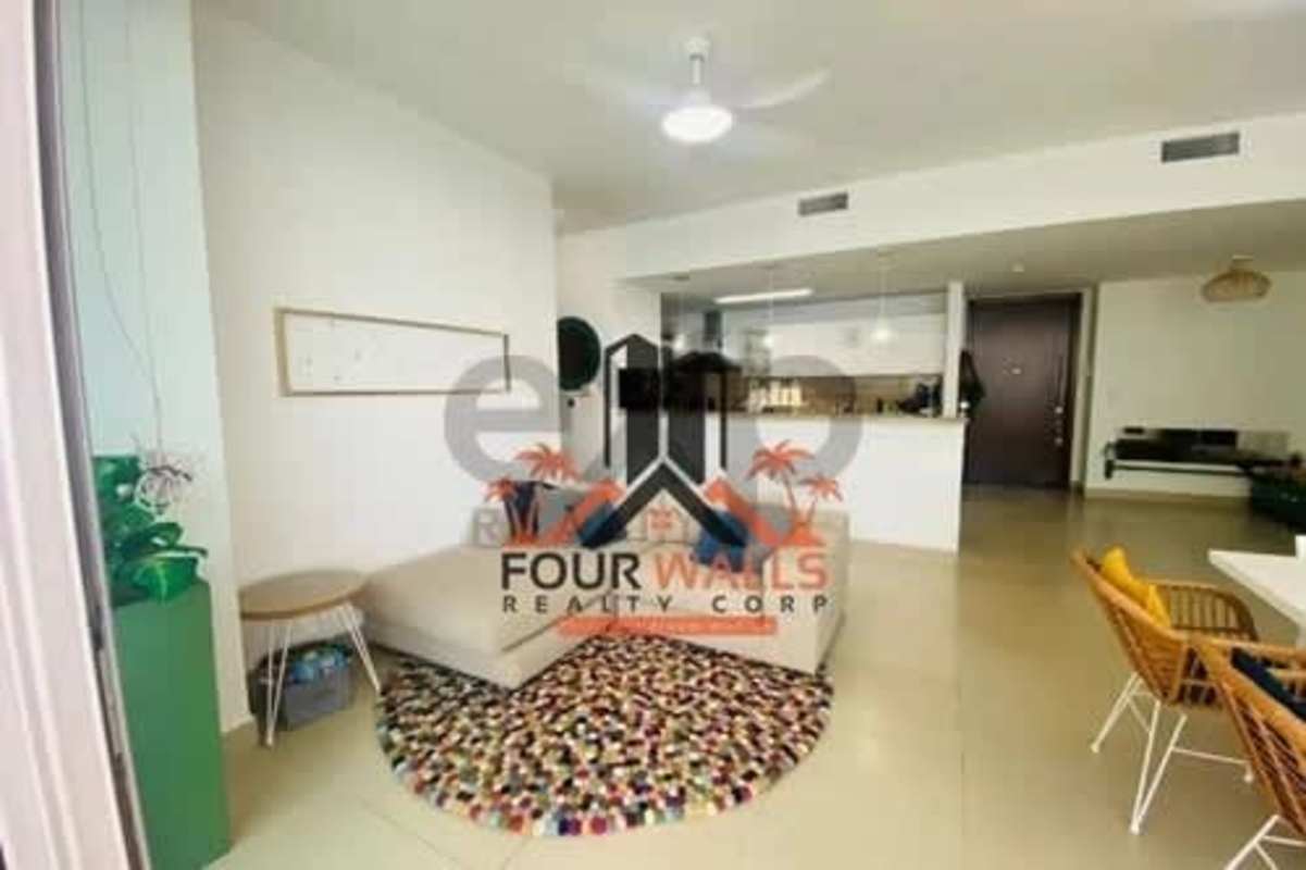 Modern galley kitchen with white cabinets and wood counters