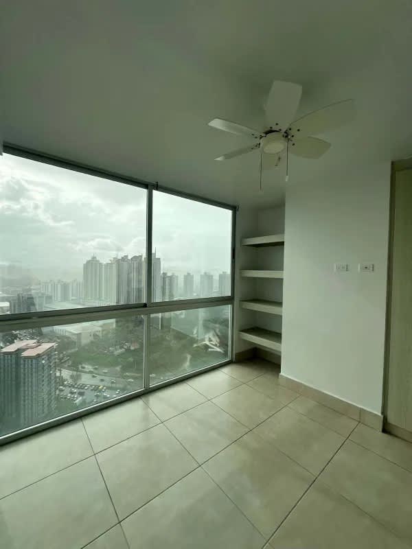 Bedroom with floor-to-ceiling windows city view ceiling fan PH Sky Point Panama