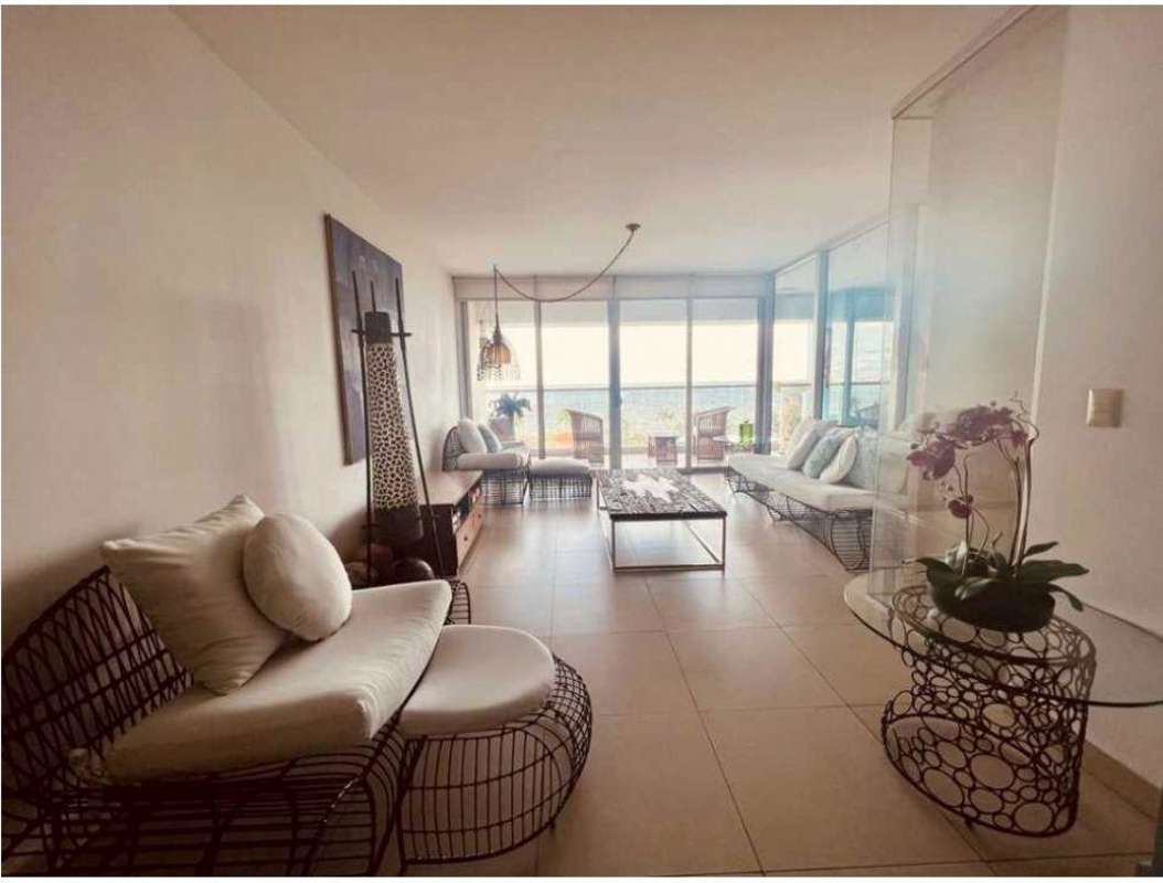 Living room with panoramic ocean views from floor-to-ceiling windows in PH Rivage Tower apartment
