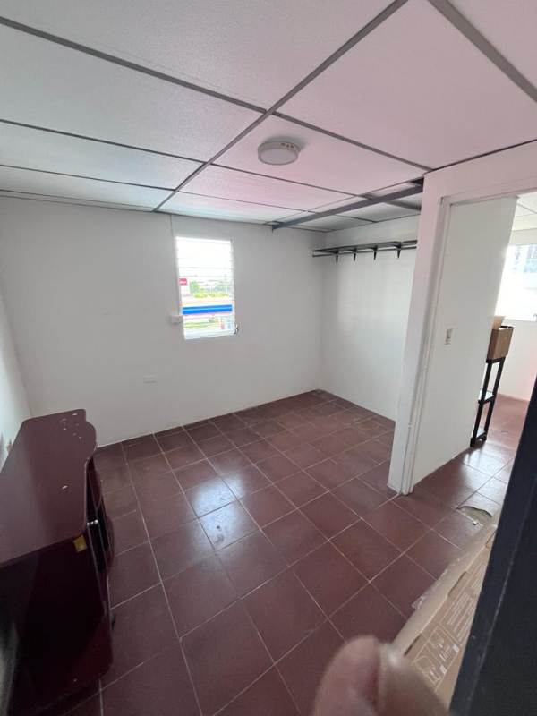 Simple bedroom with tiled floors, window, wardrobe space in Panama rental Hato Pintado