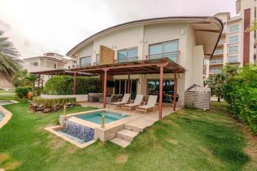 Modern kitchen with appliances quartz counters and wood cabinetry in beachfront villa Playa Escondida Panama