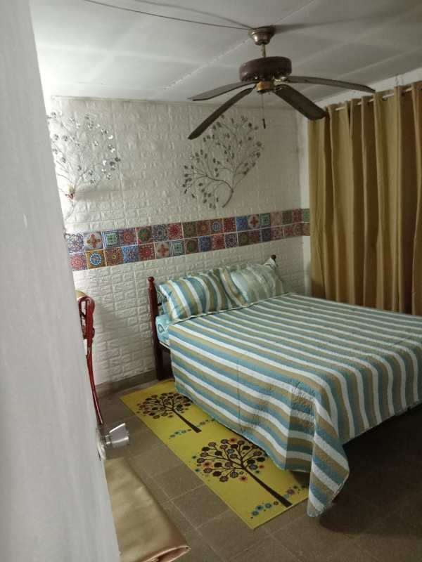Cozy family bedroom tiled floor built-in closet potential for ceiling fan Panama City