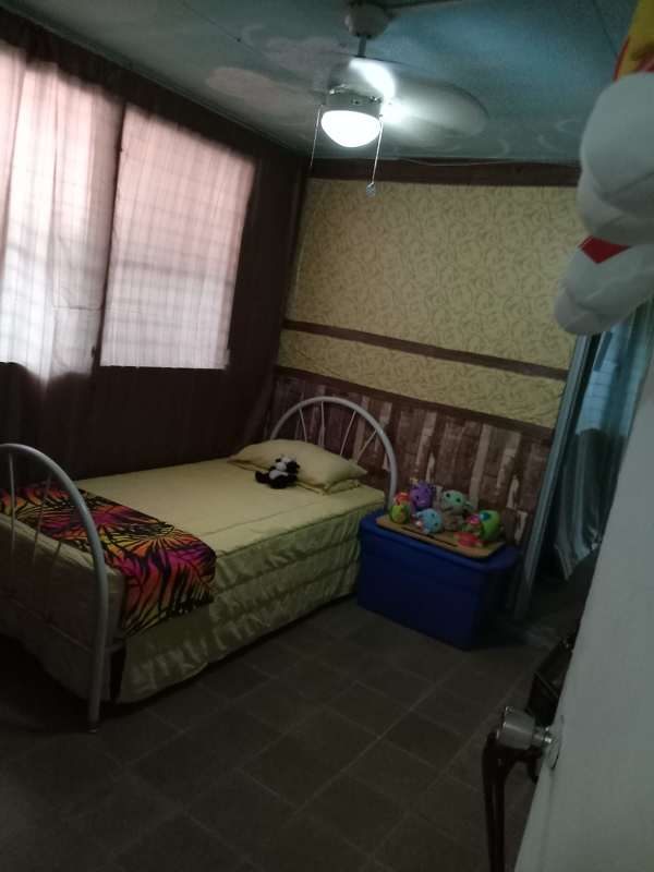 Living and dining open area of 4BR house with tiled floors, brick wall, entertainment center in Santa Clara area