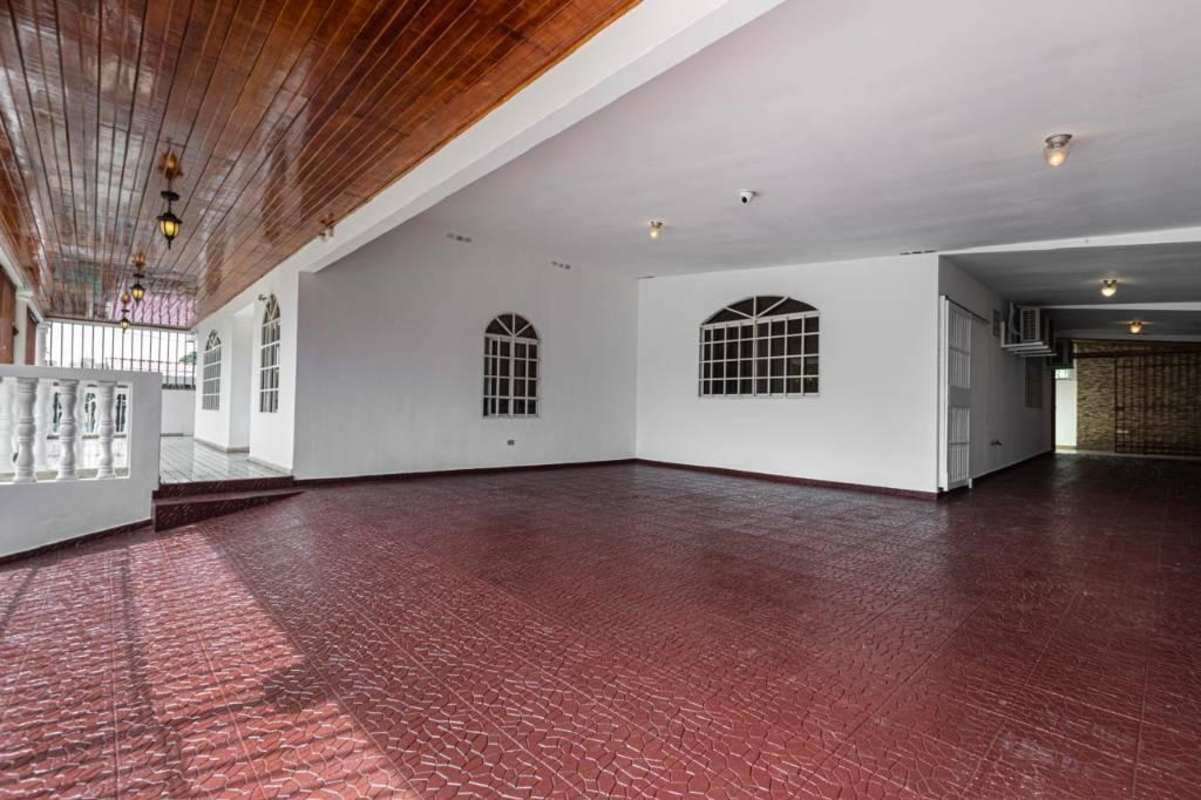 Spacious living room with mounted TV, tiled floor, and modern design in Rio Abajo Panama