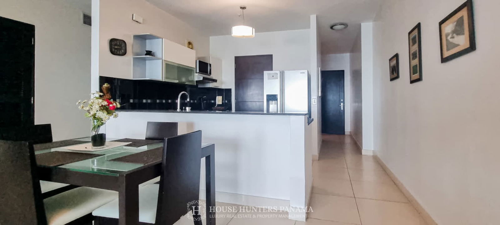 Bedroom with large window modern decor green accent wall wooden furniture Destiny Tower Panama City