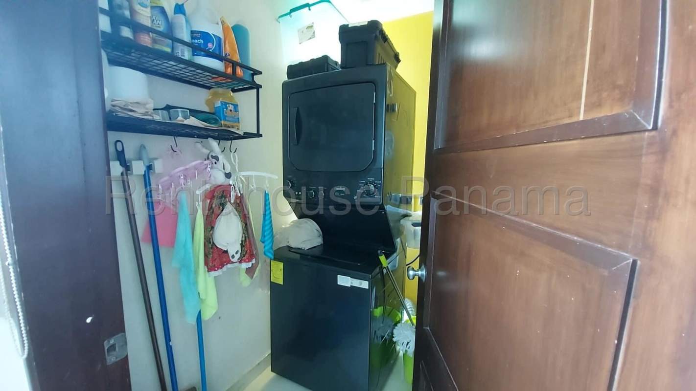 Open concept kitchen granite counters mosaic backsplash stainless appliances PH Riverside Costa del Este Panama