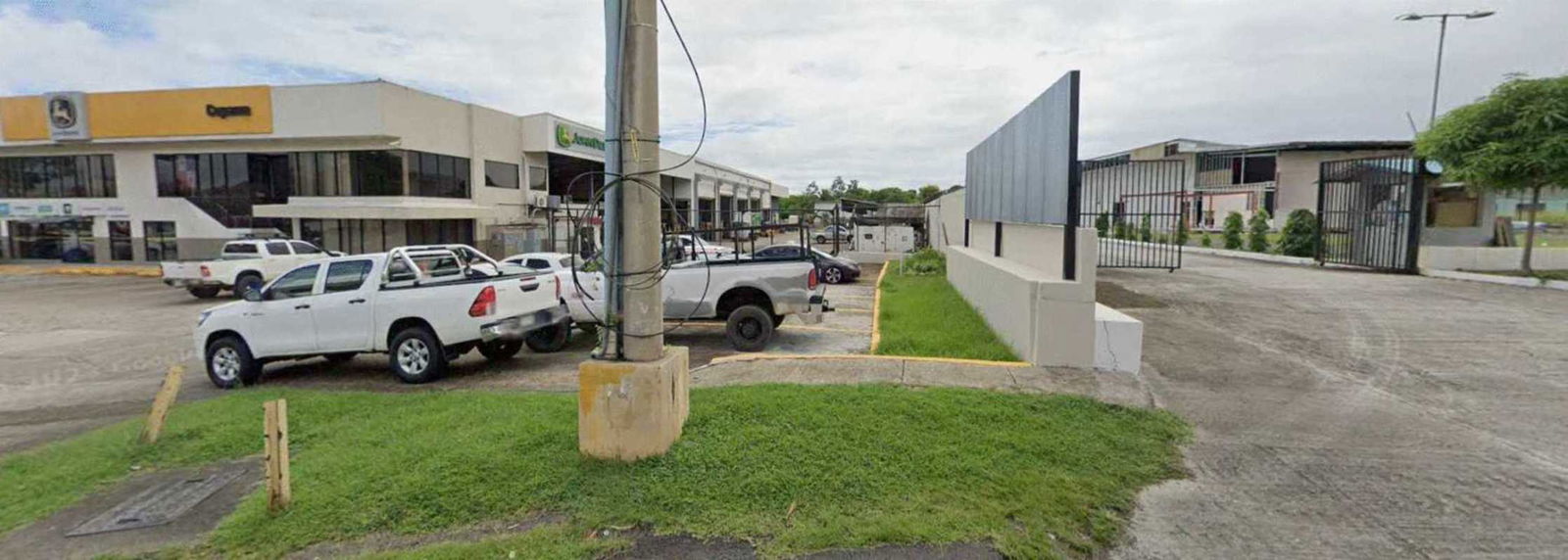 View of elevated metro station and nearby shopping plazas at Av Domingo Díaz commercial district Panama