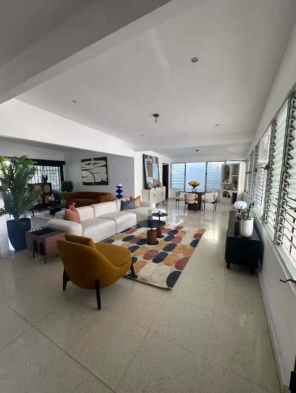 Spacious backyard patio with potted plants and city skyline view at Altos del Golf Coco del Mar Panama