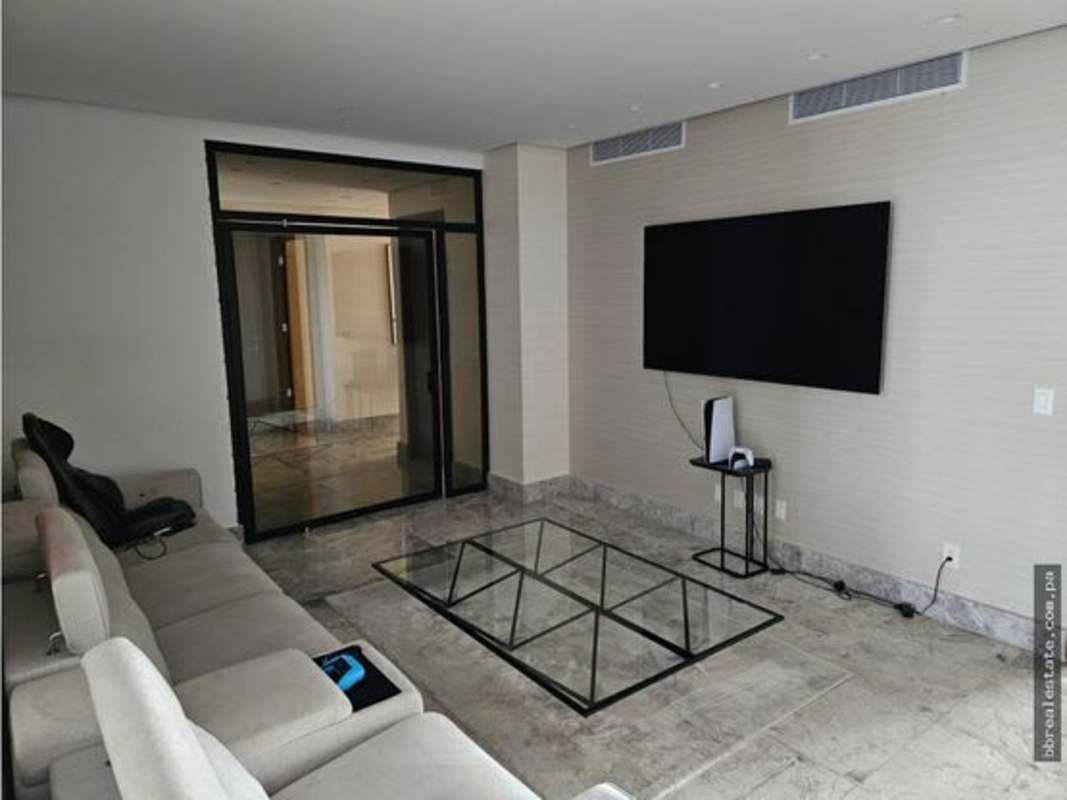 Open-plan living dining room with marble floors, floor-to-ceiling windows, and balcony PH Empire Santa Maria Panama