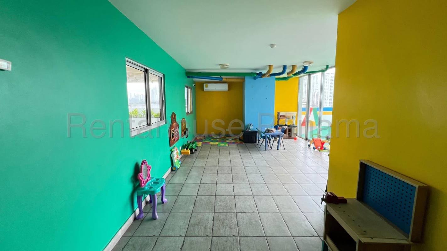 Rooftop swimming pool with city skyline and ocean views at PH Moon Tower Panama City