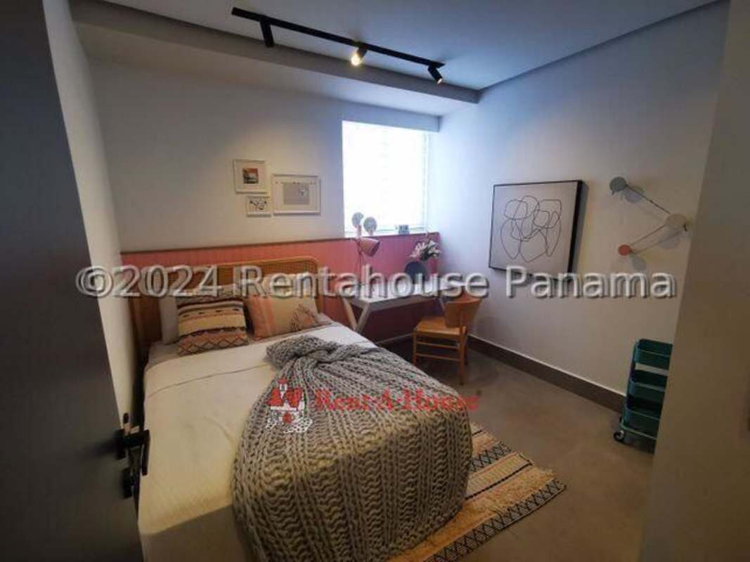 Spacious modern kitchen with granite counters and cabinetry in Victory Sport Tower