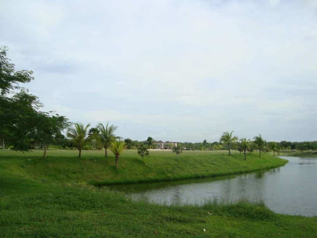 Water pond golf course view with manicured landscape and fountain at Santa Maria Golf Panama