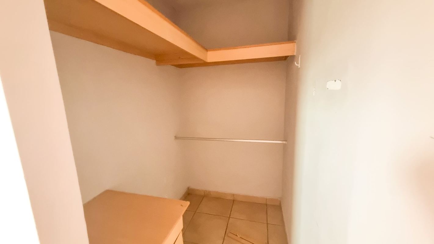 Spacious walk-in closet with shelving in townhouse PH Alpes Panama