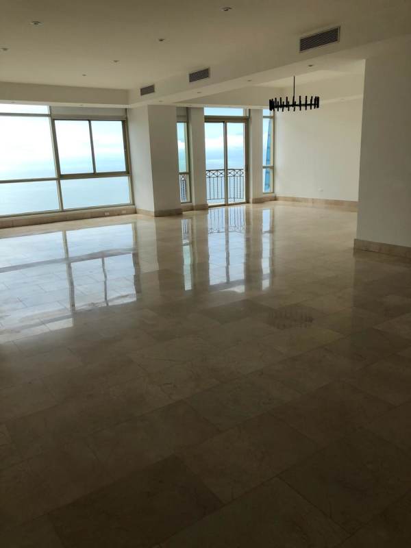 Large bright living area with marble floors and panoramic windows in Pacific Point Panama