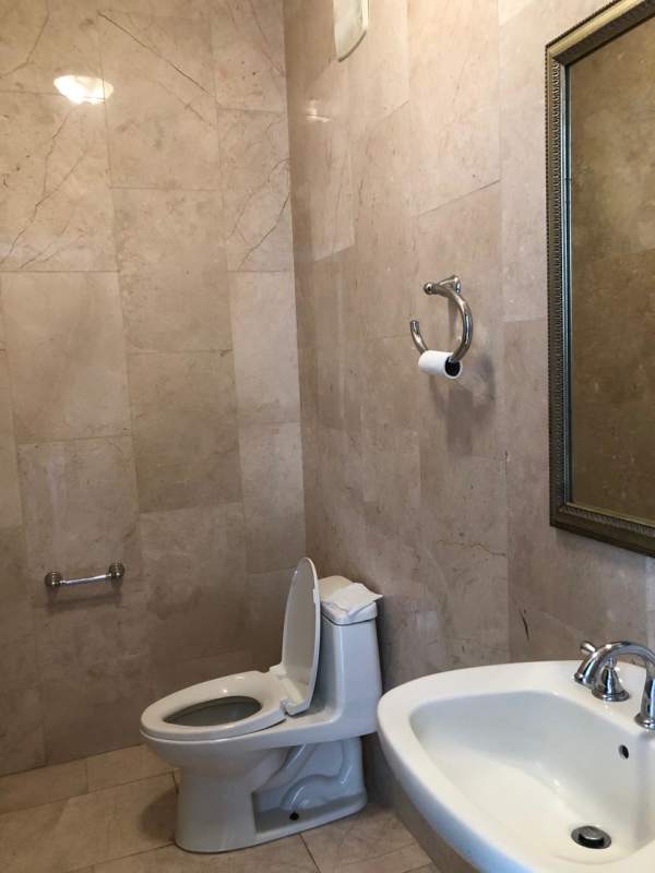 Bathroom with marble tiles, glass shower enclosure, and luxury fittings at Pacific Point Panama