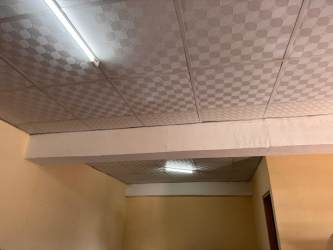 Modern commercial plaza exterior with balconies and parking in Bajo Boquete Panama