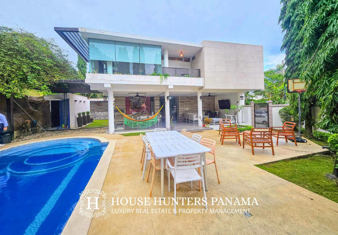 Modern architecture with outdoor dining, hammock, pool and balcony in Altos de Panamá luxury residence