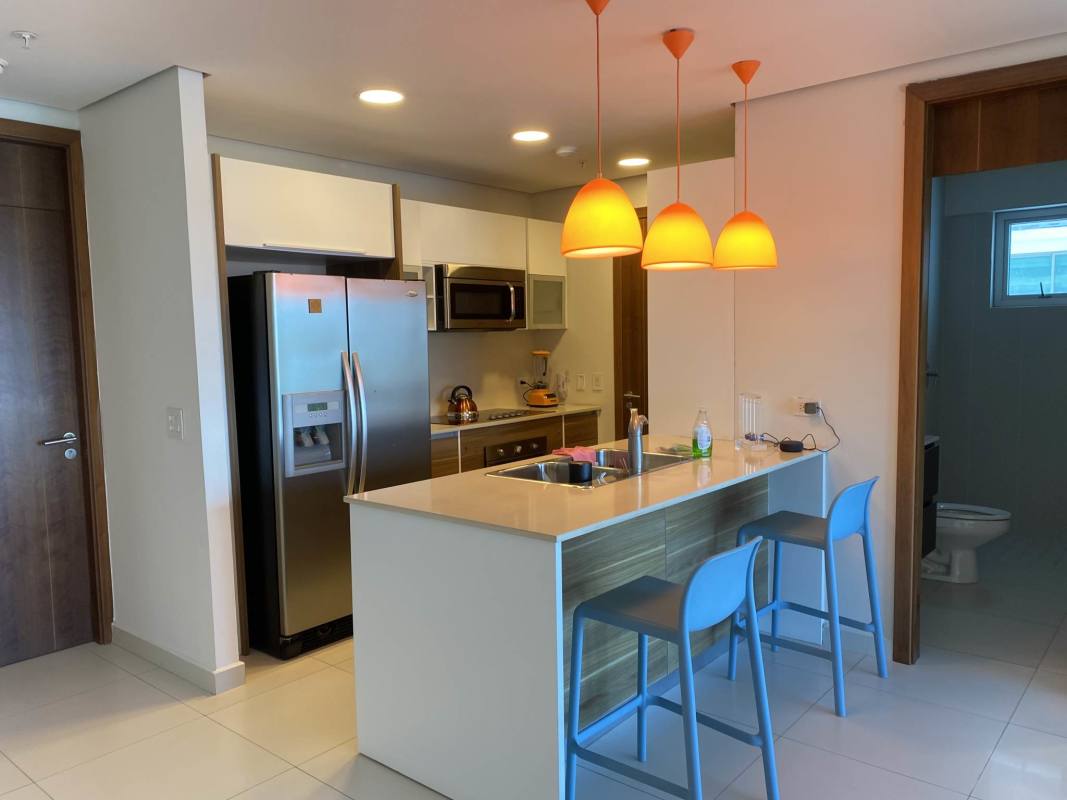 Kitchen with granite countertops and stainless appliances in PH Parkside Costa del Este Panama