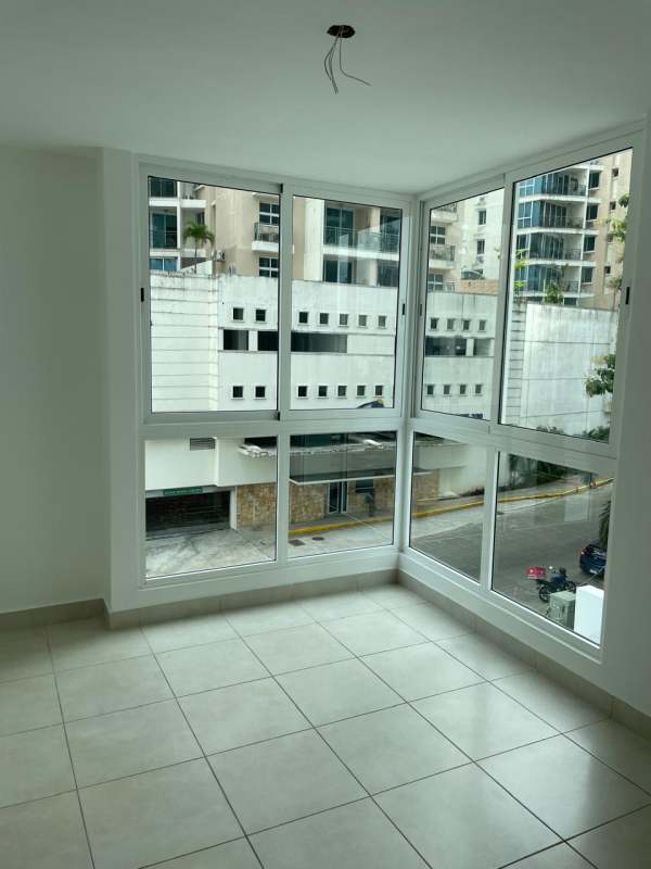 Bright living room with floor-to-ceiling windows and balcony access PH Mare 700 Edison Park Panama