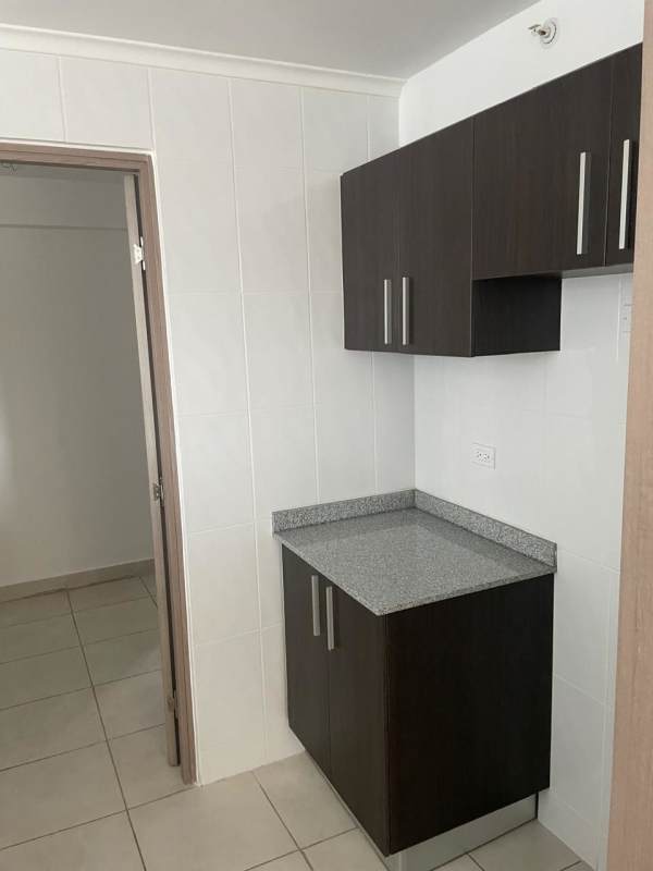 Kitchenette area with dark cabinets and granite surface PH Mare 700 Edison Park Panama