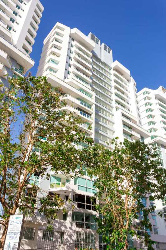 Modern high-rise building with balconies trees PH Mare 700 Edison Park Panama