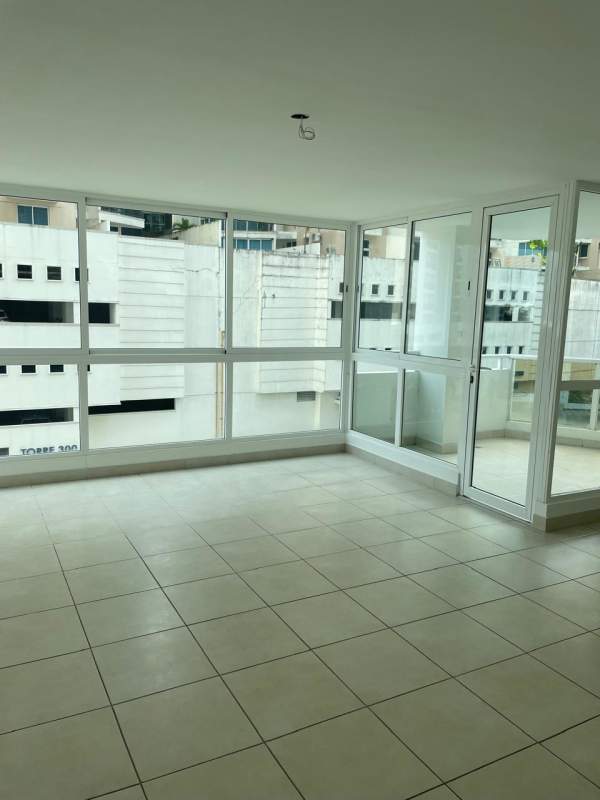 Living area with glass sliding doors to balcony PH Mare 700 Edison Park Panama City