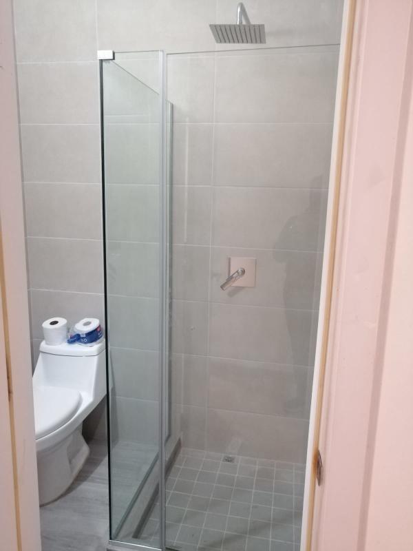 Bedroom-like space or flexible office layout with upholstered bed and minimalist decor PH Oasis on the Bay Punta Pacifica Panama