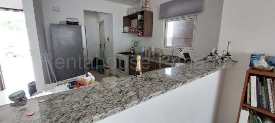 Contemporary L-shaped granite countertop kitchen in Costa Verde New West II Panama house for sale