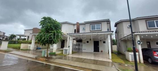 Front facade view of two-story modern house with covered parking in Costa Verde New West II Panama