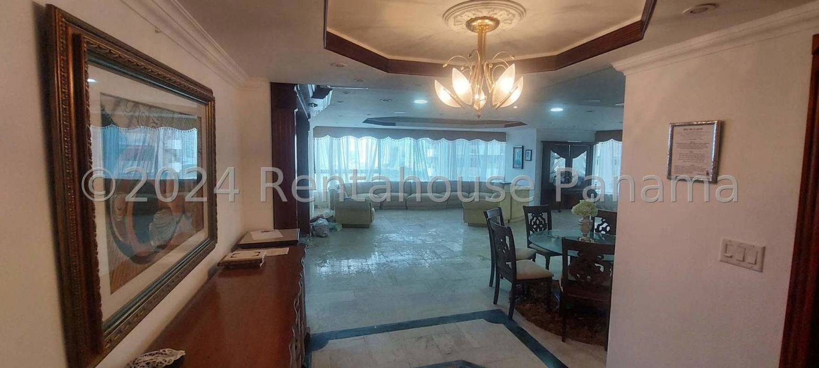 Contemporary living room with marble flooring large windows and ocean views in Punta Paitilla