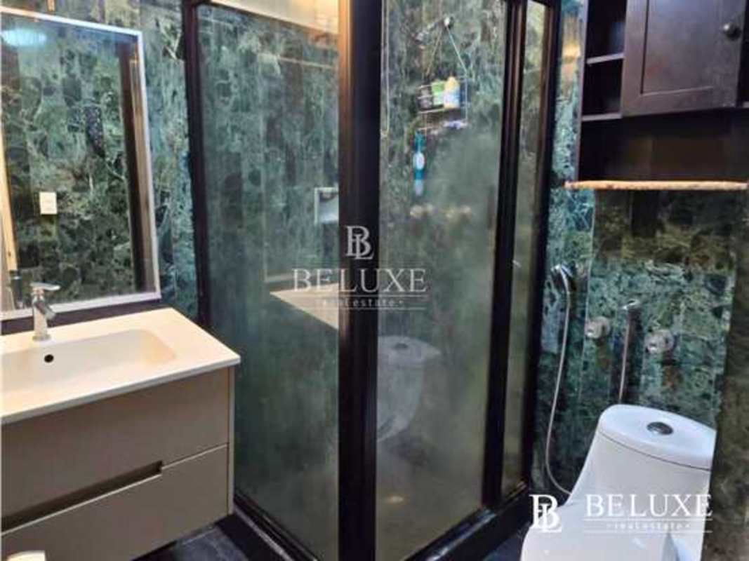 Spacious bedroom with city skyline view large window PH Vizcaya Panama