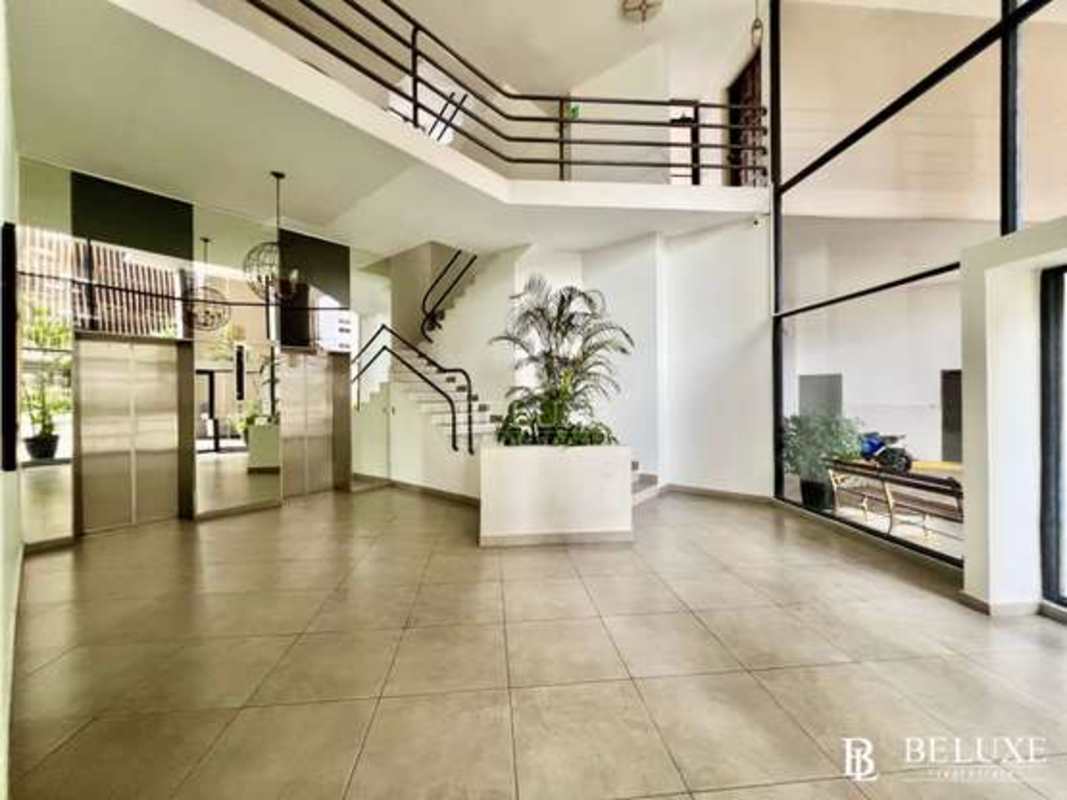 Bright living room with panoramic windows porcelain floors PH Vizcaya