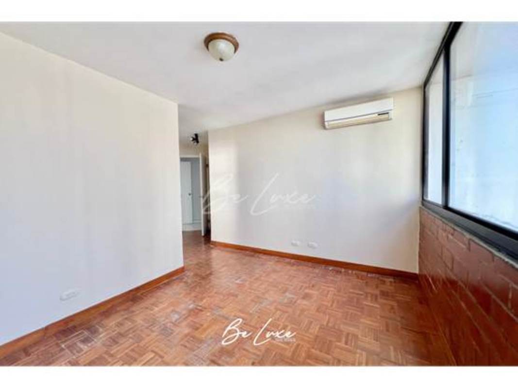 Bright living room with large windows, ocean views, porcelain floors, PH La Caleta Coco del Mar