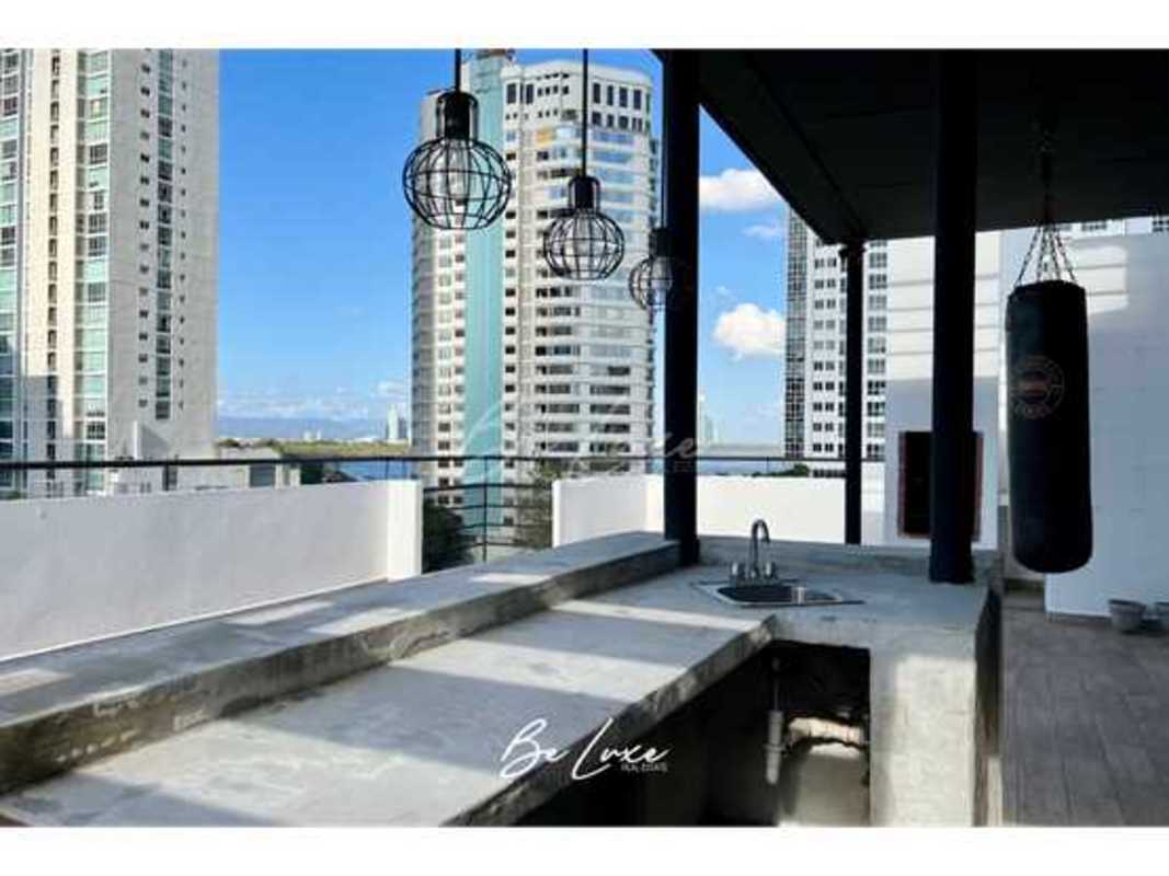 Large master bedroom with city and ocean views, wood floors, AC at PH La Caleta Panama