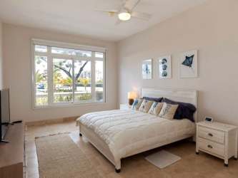 Contemporary bedroom bright natural light large window Buenaventura Marina Village Panama