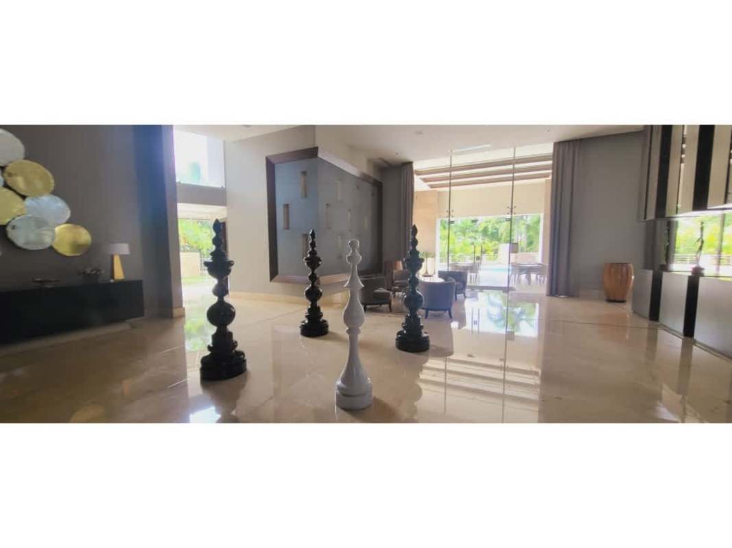 Infinity edge swimming pool with lounge area at Valery Point Santa María luxury condo Panama