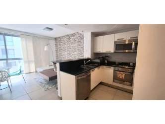 Modern open-plan kitchen with granite countertops and mosaic backsplash PH Mosaic Panama City