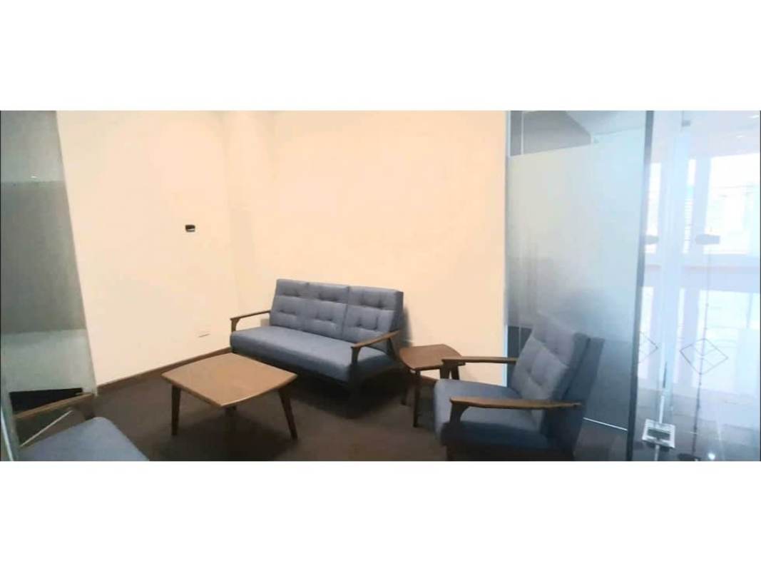 Modern conference room with white tables, black chairs and blue accent wall in Ocean Business Plaza Torre Banesco Panama City